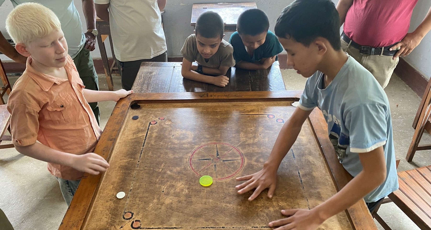 Nepal Boys Playing Board Game In Gyan Chakshu School